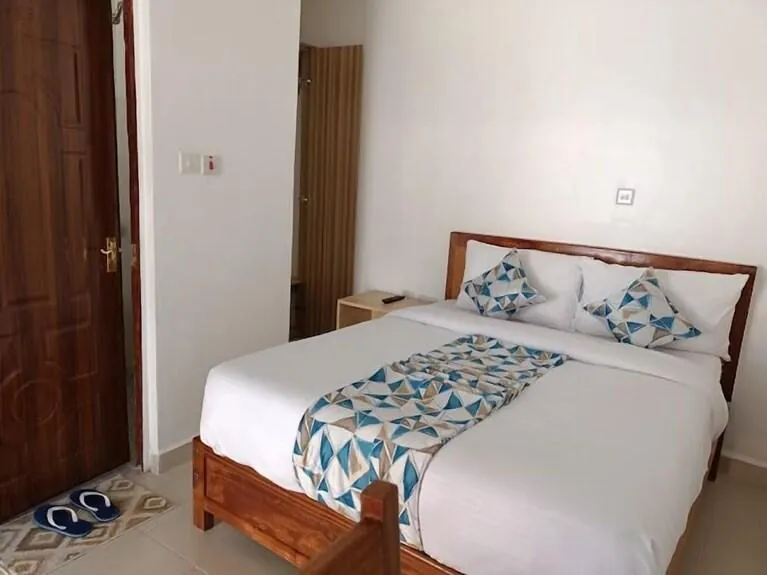 Guest room with a double bed at Leisure Apex, Naivasha