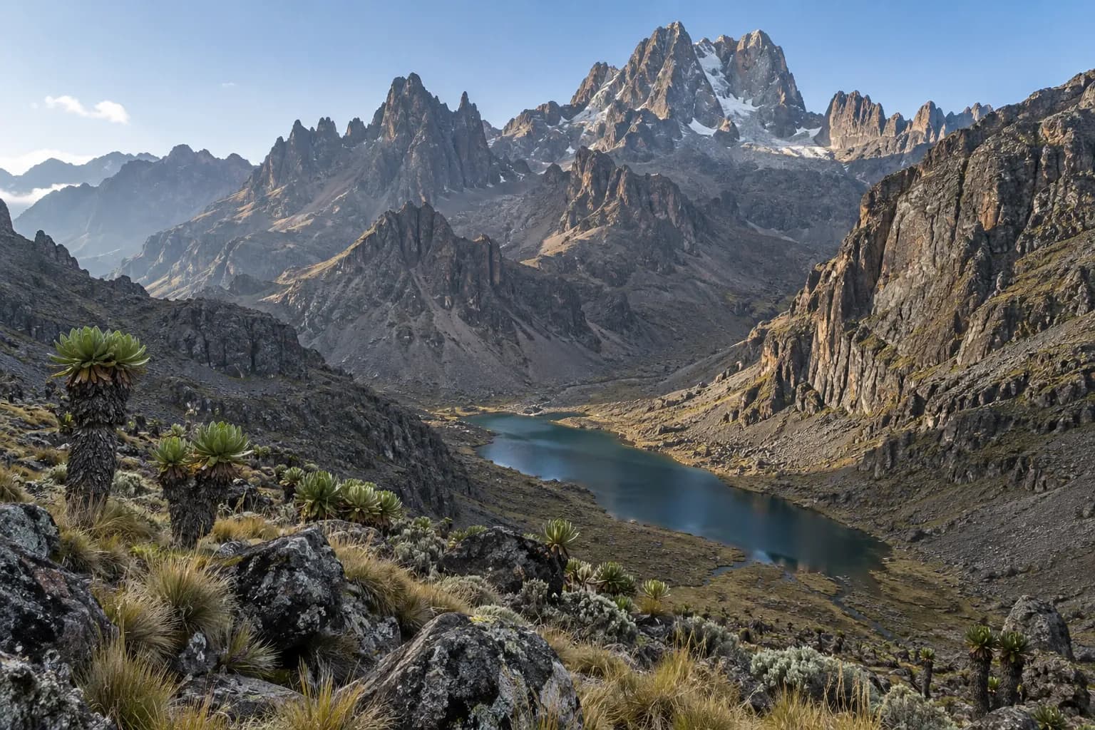 Lake Michaelson beneath the volcanic cliffs of Mount Kenya