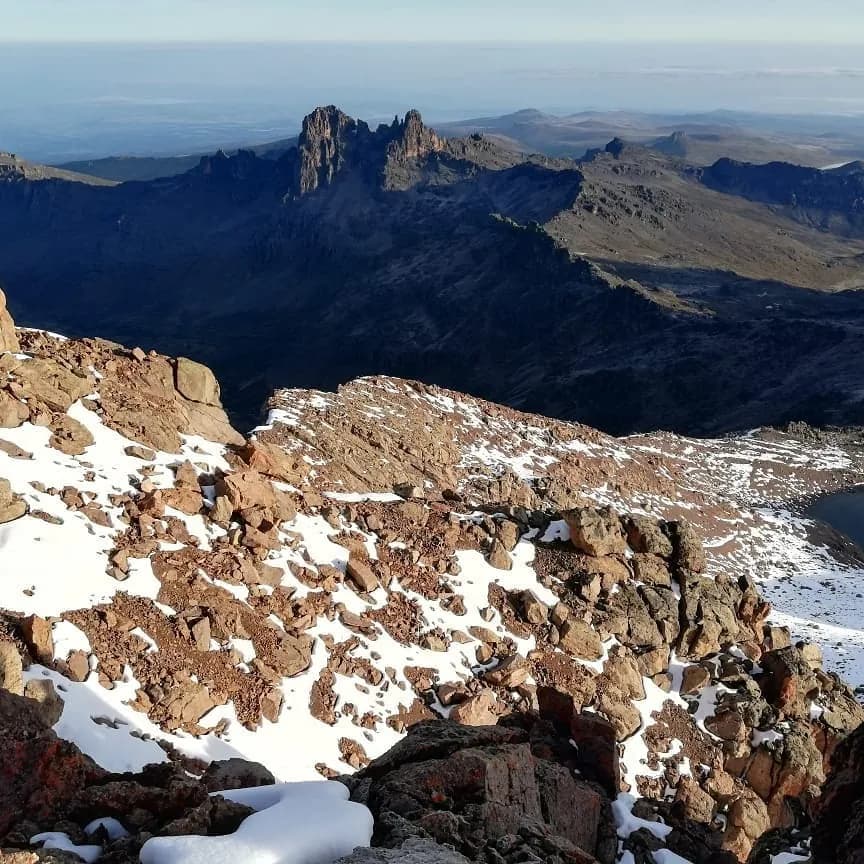Snow-patched rocky ridges near Mount Kenya's summit