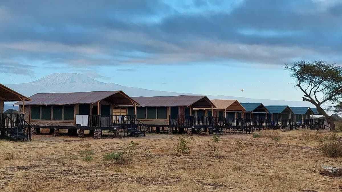 Tented cabins at Nyati Safari Camp, Amboseli, with Kilimanjaro behind